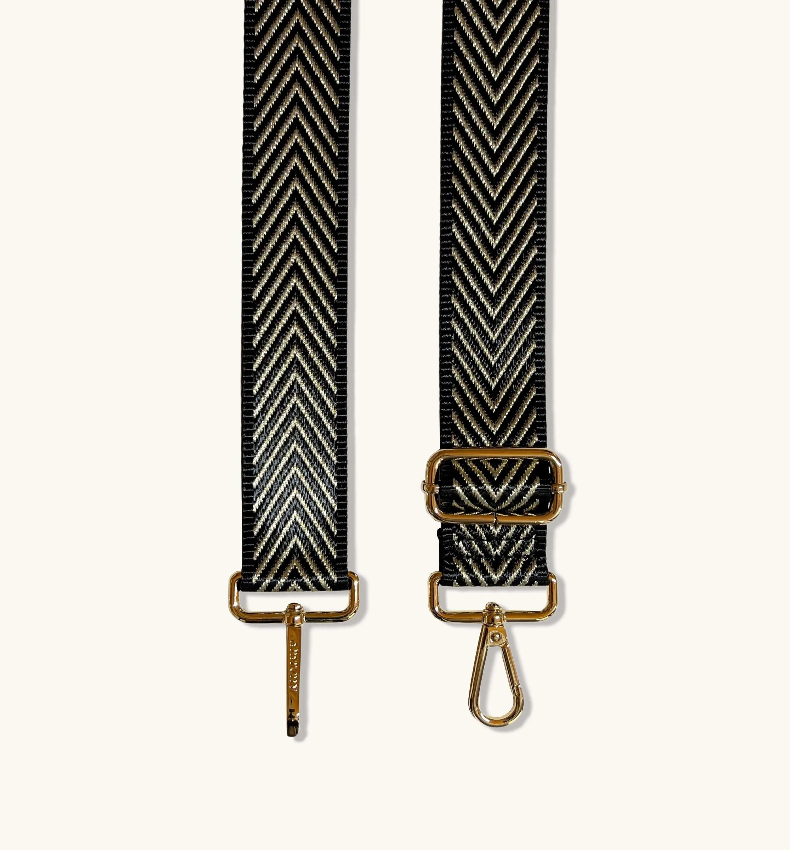 The Tassel Gold Leather Crossbody Bag With Black & Gold Chevron Strap