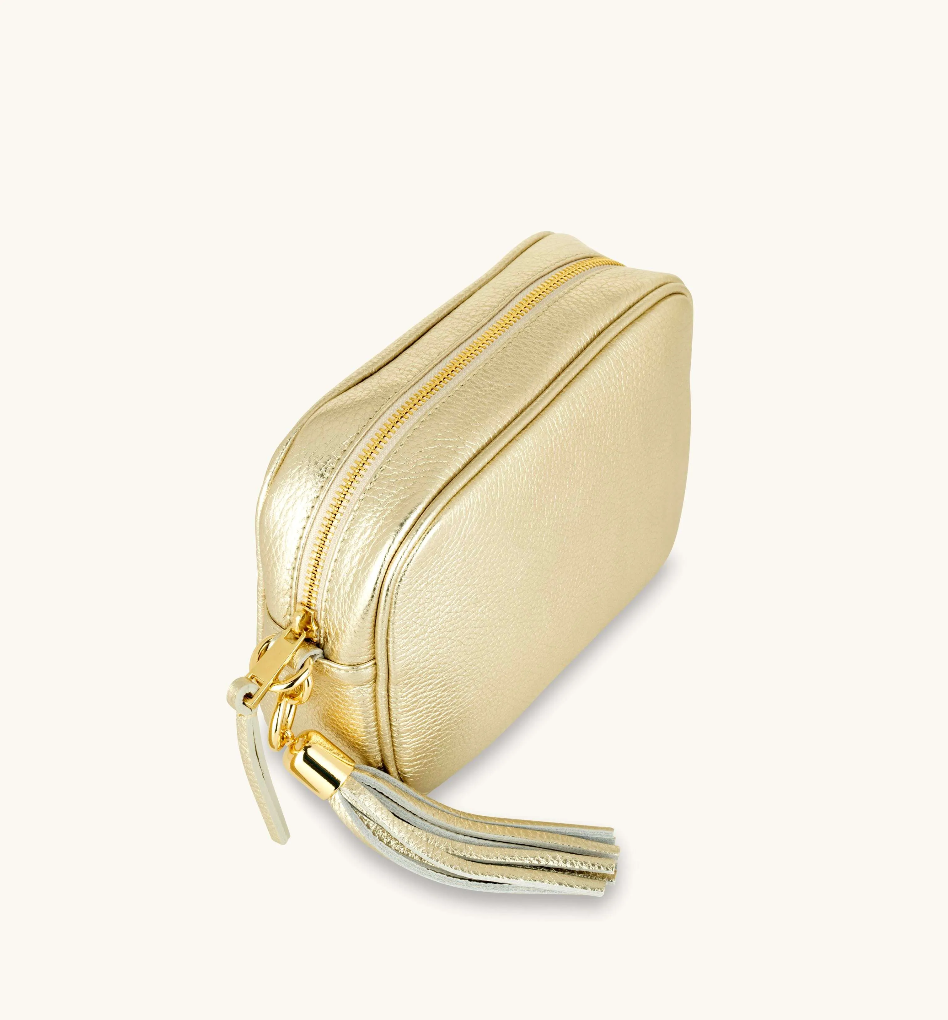 The Tassel Gold Leather Crossbody Bag With Black & Gold Chevron Strap